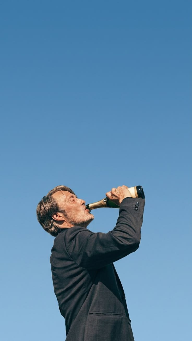 a man in a suit holding a baseball bat